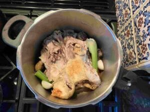 A chicken carcass in the pressure cooker